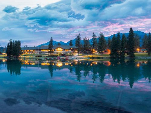 a view of a lake at night at Fairmont Jasper Park Lodge in Jasper