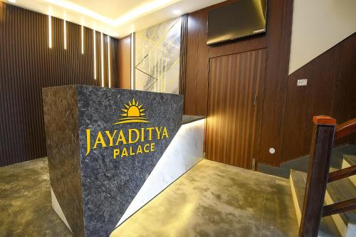 a lobby with a sign for the akwa ibrahim palace at Hotel Jayaditya Palace Near Ram Mandir in Ayodhya