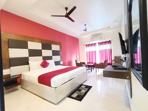 Postel nebo postele na pokoji v ubytování Hotel New Rajdarshan