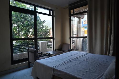 Voodi või voodid majutusasutuse Hotel arti cottage toas