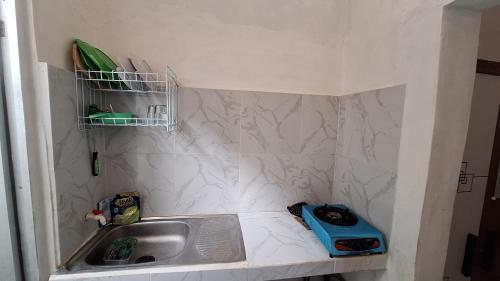 Kuchyň nebo kuchyňský kout v ubytování First Guest House Syariah