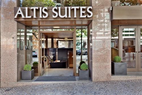 a building with a sign on the front of it at Altis Suites in Lisbon