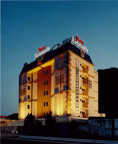 a building with a sign on top of it at Hotel Antoinette -SPA RESORT- AdultOnly in Okazaki