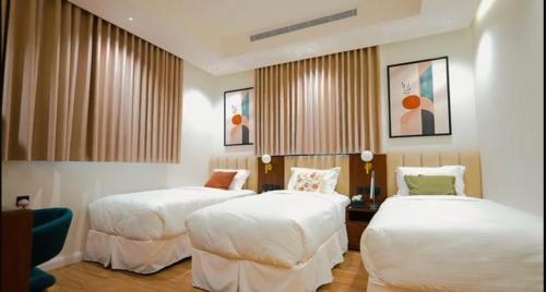 Ένα ή περισσότερα κρεβάτια σε δωμάτιο στο شاليهات روز الحديقة