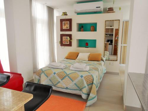 a bedroom with a bed with towels on it at Depto Tipo Apart in Salta