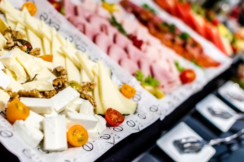 a display of different types of food on a table at Exe Ramblas Boquería in Barcelona