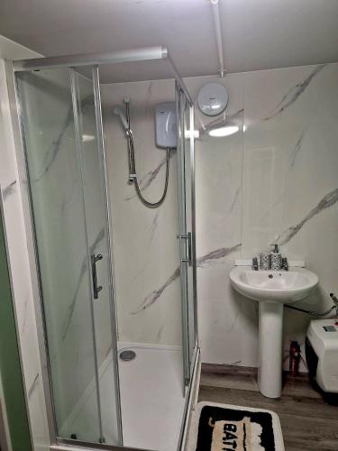 a bathroom with a shower and a sink at 'Little Star' accommodation in Heathfield