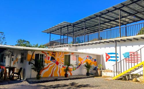 a building with a mural on the side of it at MejorClub in Valle de Anton