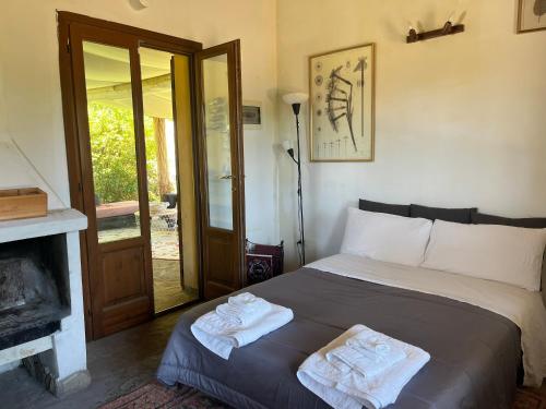 Ένα ή περισσότερα κρεβάτια σε δωμάτιο στο SassiNeri Country House