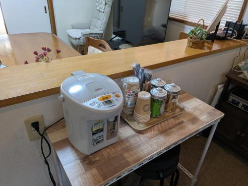 a table with a juicer on top of a counter at Minpaku ROADHOUSE - Vacation STAY 20160v in Nagasaki