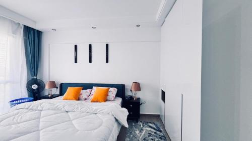 Postel nebo postele na pokoji v ubytování Orchid residency