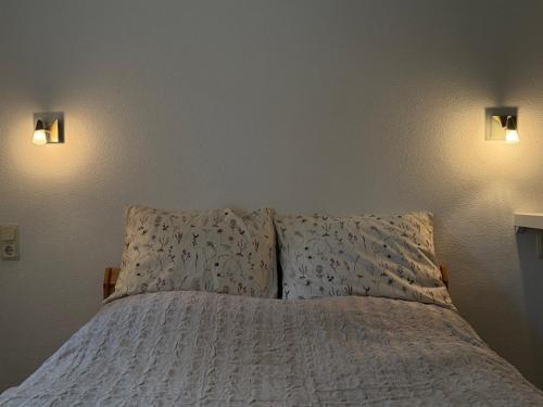 En eller flere senge i et værelse på Fricis Appartment