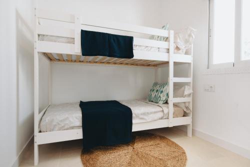 Ένα ή περισσότερα κρεβάτια σε δωμάτιο στο Apartamento B