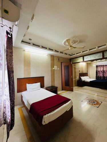 Postel nebo postele na pokoji v ubytování HOTEL GOLDeN PARK