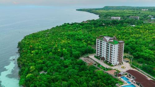 an aerial view of a building on an island in the water at Peaceful Panglao Escape for Families & Couples in Dao