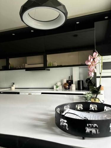 a kitchen with a black and white counter top at Black&White Deluxe in Miskolc
