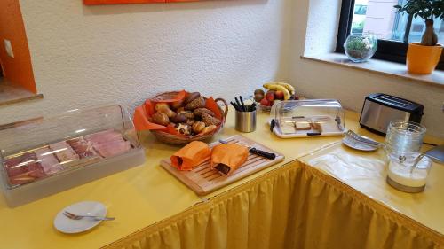 a table with a buffet of food on it at Hotel Trutzpfaff in Speyer
