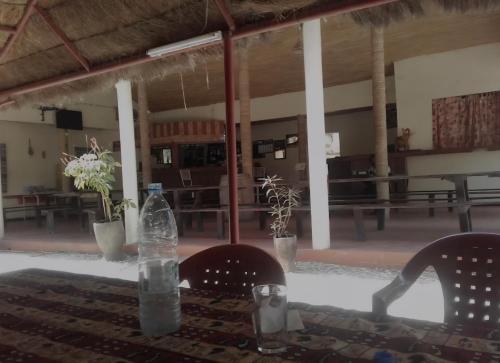 a bottle of water sitting on top of a table at Le Finio 