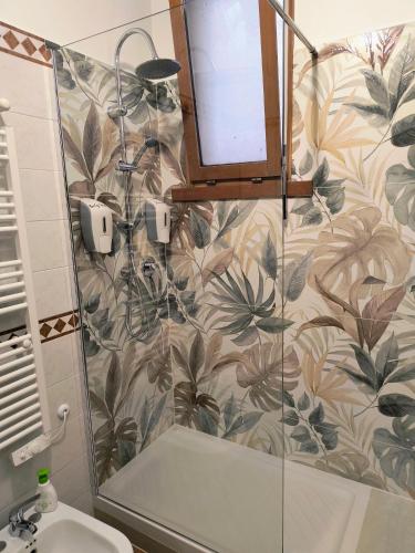 a bathroom with a shower and a sink at BePlace La Nuvola in Rome