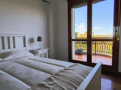 Voodi või voodid majutusasutuse BePlace La Nuvola toas