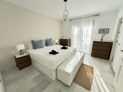 En eller flere senge i et værelse på SR Torremar precioso chalé con jardín