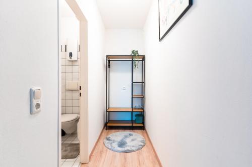 a bathroom with a toilet and a mirror at Im Herzen von Bad Ischl#3 in Bad Ischl