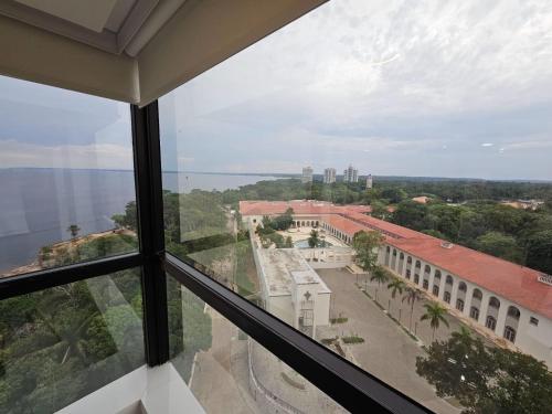a view from the window of a building at Tropical Executive Flat in Manaus