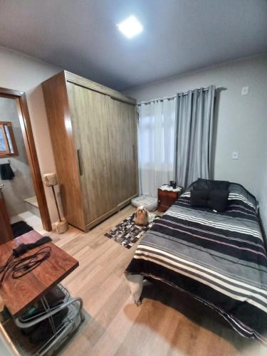 Postel nebo postele na pokoji v ubytování Aluguel Quarto Oktoberfest