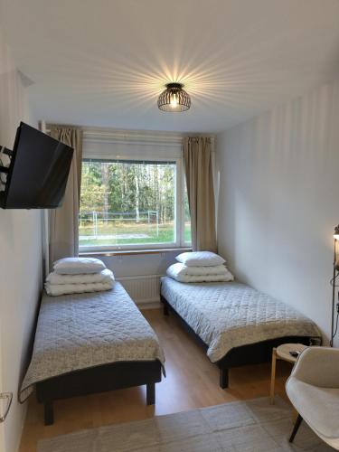 Postel nebo postele na pokoji v ubytování Asuntos-3