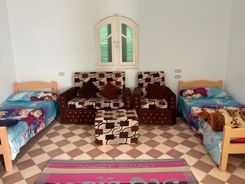 Postel nebo postele na pokoji v ubytování ايـو كـاتو