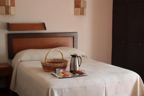 Ένα ή περισσότερα κρεβάτια σε δωμάτιο στο Hotel Ilebal Cuernavaca Centro - lugar con encanto!