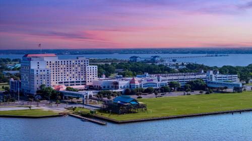 an aerial view of a city with a river and buildings at Harrah's Gulf Coast Hotel & Casino - A Caesars Rewards Destination in Biloxi