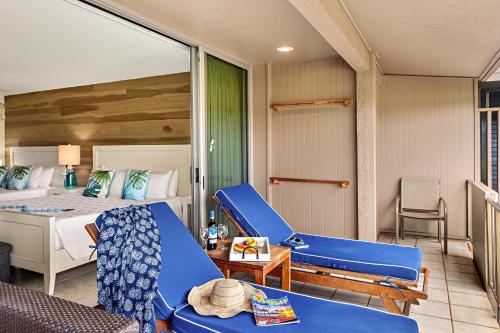 a hotel room with a bed and a couch at Maui Eldorado Condo J206 in Kaanapali