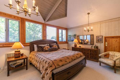 a bedroom with a bed and a chair at Endless Vistas in Seven Devils