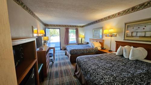Ένα ή περισσότερα κρεβάτια σε δωμάτιο στο Imperial Lodge