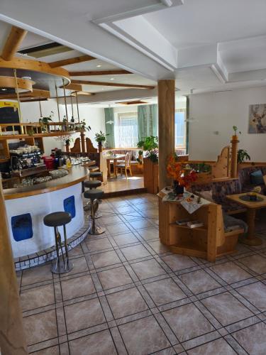 a large room with a kitchen and a living room at Landcafe Kauder in Stadl an der Mur