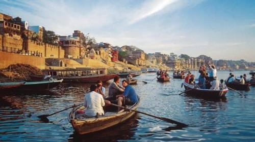 a group of people in boats in the water at 7BHK FLATS Kashi Vishwanath Jyotirling in Varanasi