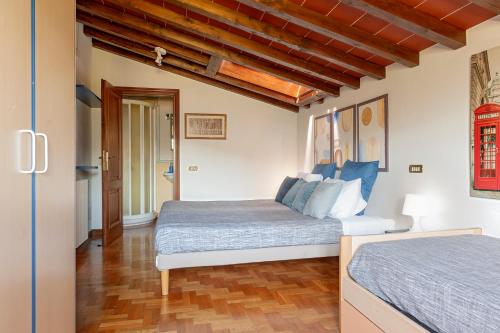 Postel nebo postele na pokoji v ubytování Villa Camelia Tuscany