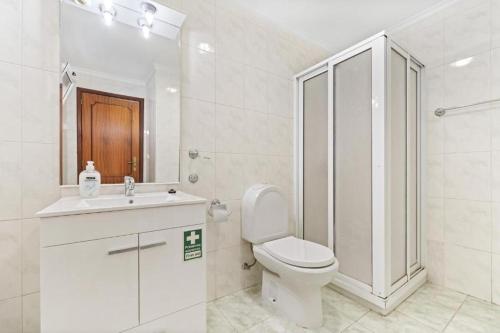 a bathroom with a toilet and a sink and a shower at Ribeira Brava Studios - L in Ribeira Brava