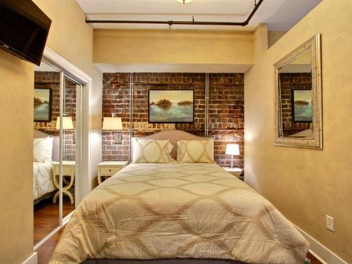 Postel nebo postele na pokoji v ubytování Soho Suite