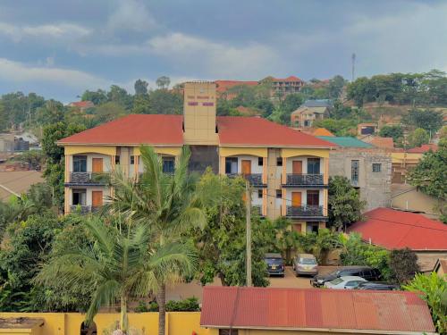 a building with a chimney on top of it at Palm Gardens Guesthouse in Kampala