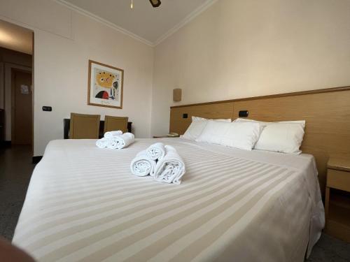 Postel nebo postele na pokoji v ubytování Hotel Riviera Belsoggiorno