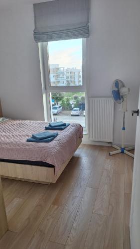 Postel nebo postele na pokoji v ubytování Apartament Kameralny