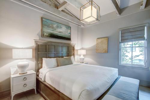 a bedroom with a large bed and a chandelier at Parker's Collection Unit 7 in Savannah