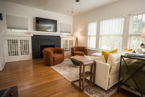 a living room with a couch and a fireplace at Location! Downtown San Antonio, Southtown, King William in San Antonio