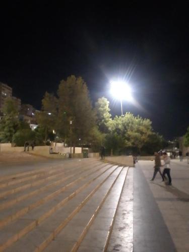 a street light on top of a park at night at وسط البلد عمان in Amman