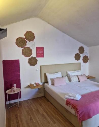 a bedroom with a large bed and a table at Pink Yellow Porto Apart in Porto