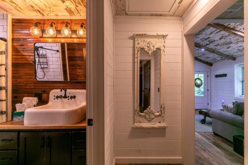 a bathroom with a sink and a mirror at Up the Creek in Linville