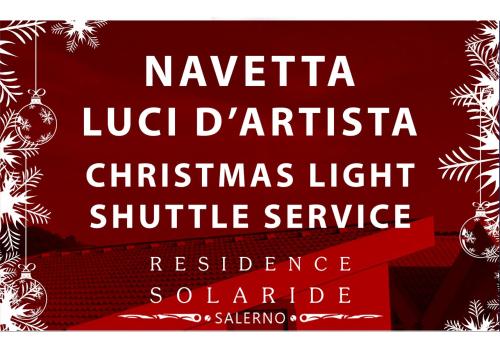 a christmas light shuttle service sign with a christmas tree at RESIDENCE SOLARIDE apartments, FREE PRIVATE PARKING WITH VIDEOSURVELLIANCE and SHUTTLE SERVICE in Salerno