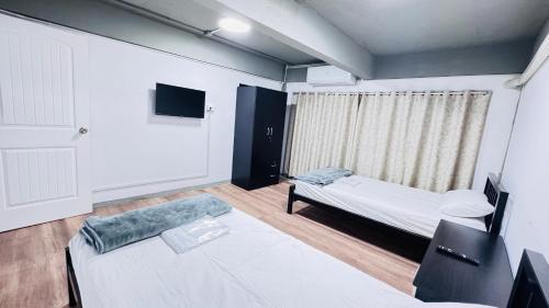 Postel nebo postele na pokoji v ubytování Aura Hostel